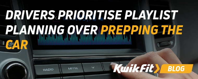 A driver adjusting the volume on their car stereo