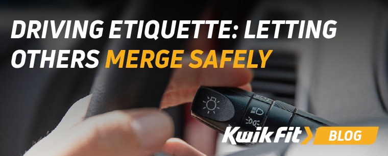 A close up of an indicator stalk being used by the driver