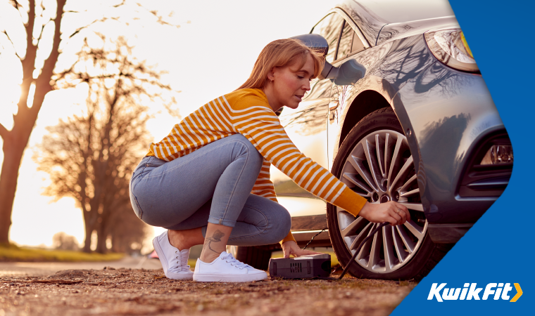 female inspecting their front wheel