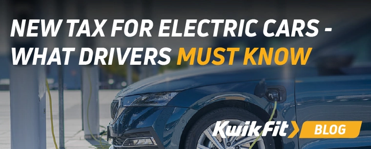 An electric saloon car pluged in at a charger